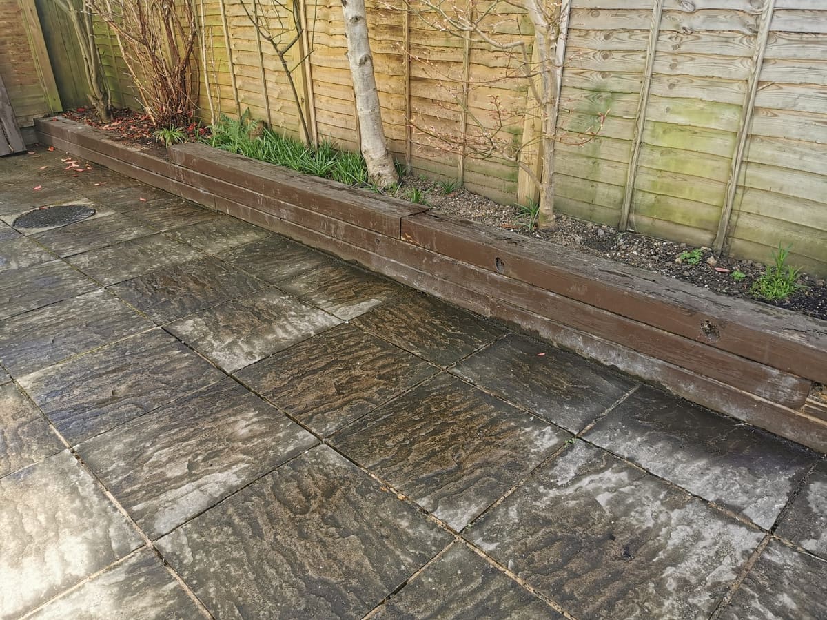Before: Old sleeper wall to a stone-clad retaining wall