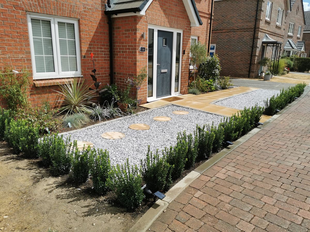 After: Front lawn to gravel, planting and box hedging