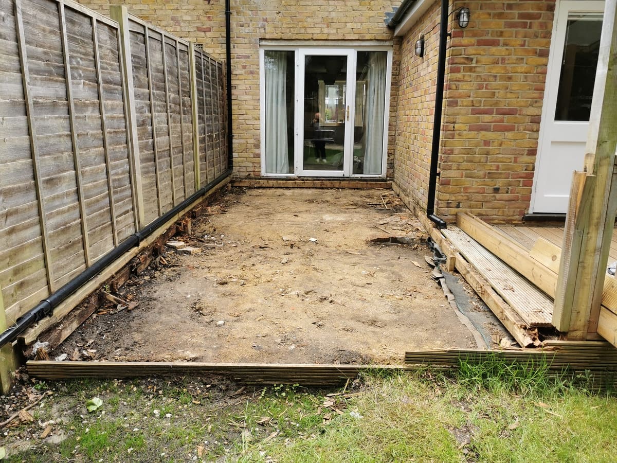 Before: Bare ground by the house to a raised porcelain patio