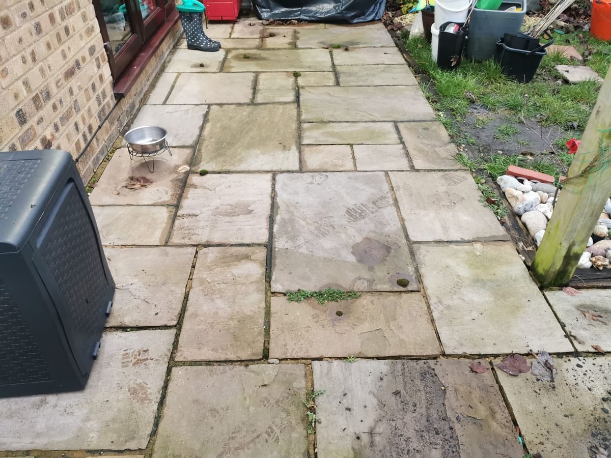 Before: Stained patio, cleaned and refurbished