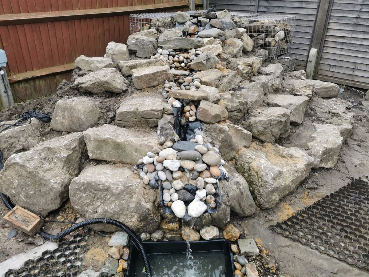 After: A pile of stone to a rockery waterfall