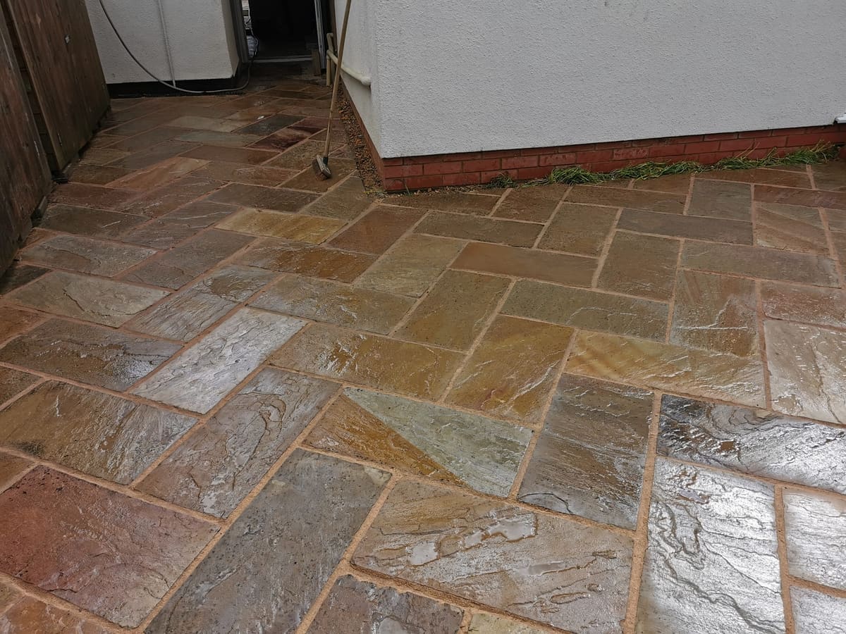 After: Worn old paving relaid in sandstone
