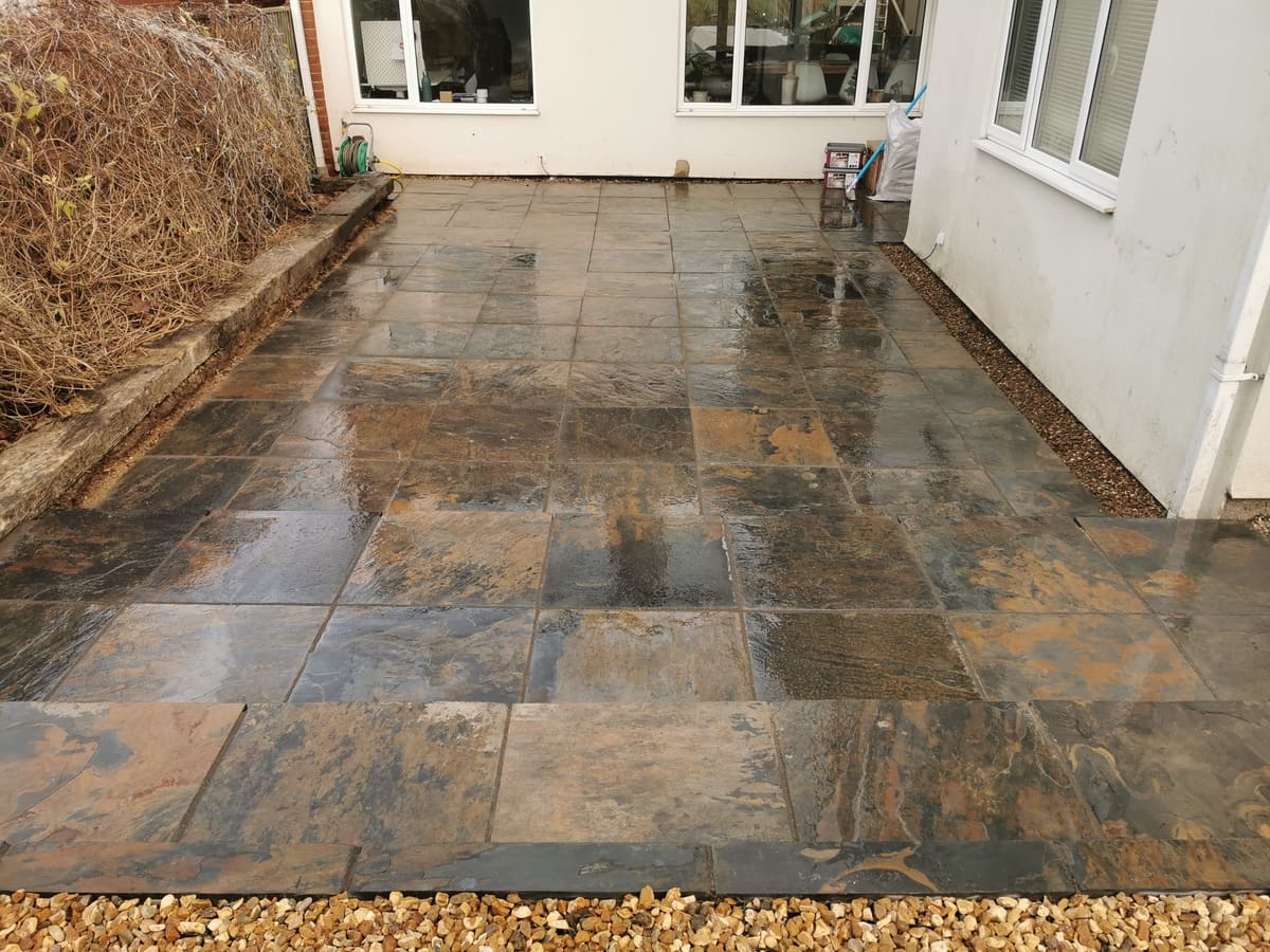 After: Cracked concrete slabs to a new slate patio